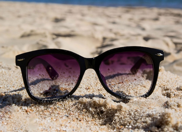 Sunglasses on the sand at the beach