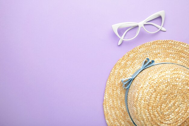 Sunglasses and striped retro haton purple surface