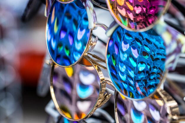 Sunglasses in which other glasses of different colors are displayed.