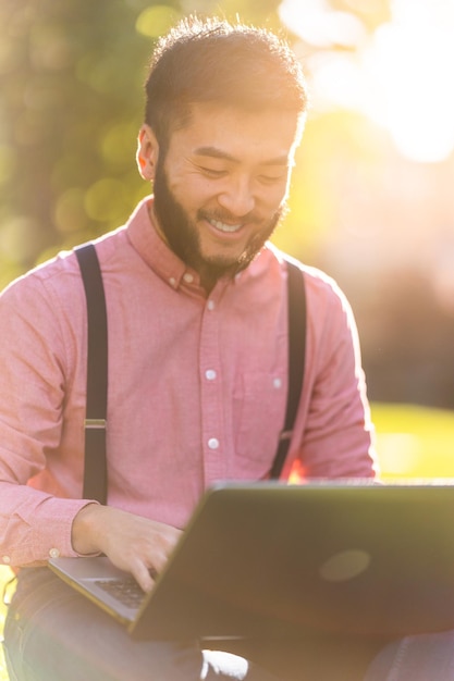 Sunlight illuminating a businessman working on a laptop