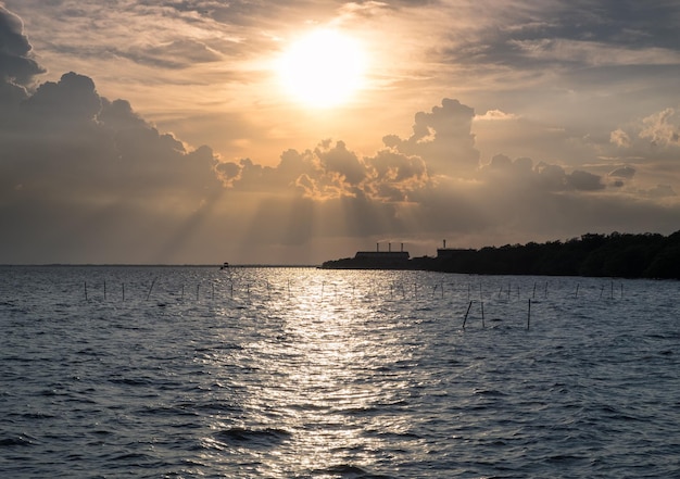 Sunlight shining sea at sunset