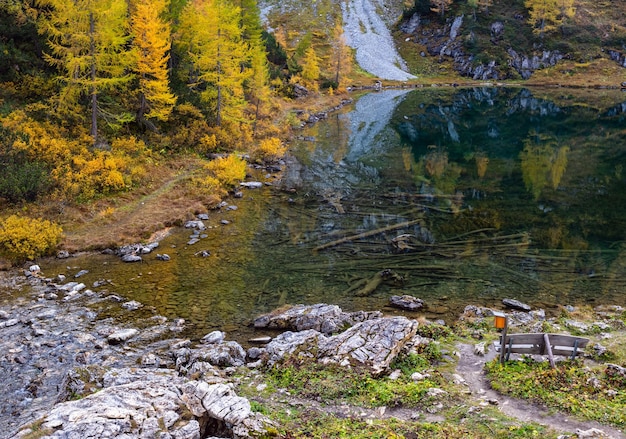 Sunny autumn alpine Tappenkarsee lake and rocky mountains above Kleinarl Land Salzburg Austria