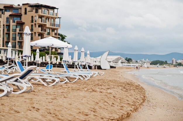 Sunny Beach on Black Sea in Bulgaria. Summer vacation travel holiday. Sunbeds.