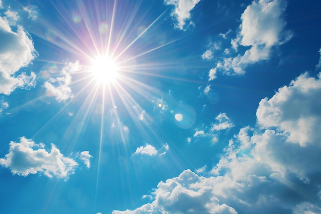 Sunny blue sky background with white clouds and sunbeams