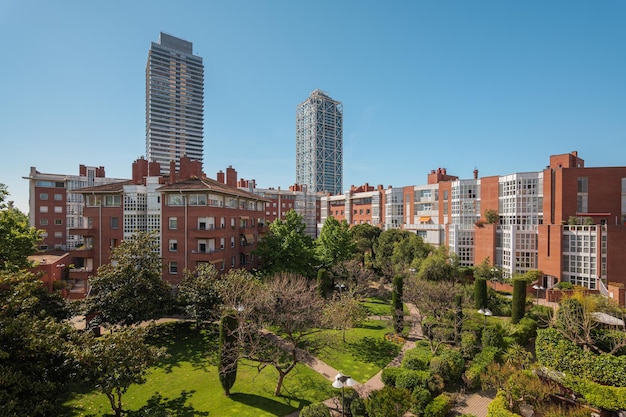 Sunny day in green european courtyard. Modern residential complex in Barcelona Spain