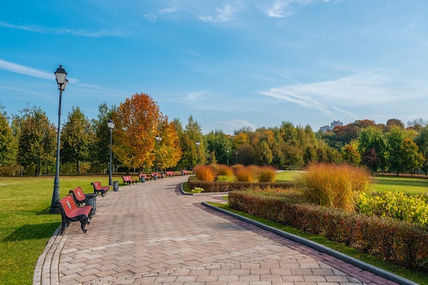 Sunny flower alley with lanterns in the autumn park. Tsaritsyno. Moscow.