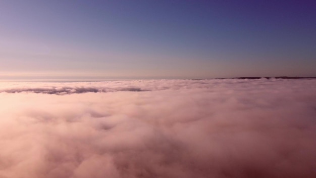 Sunrise above clouds from drone