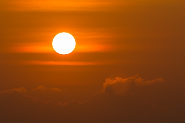 Sunrise over clouds with bright yellow sun on a morning