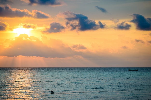 Sunrise dramatic sky on sea, tropical desert beach, no people, stormy clouds