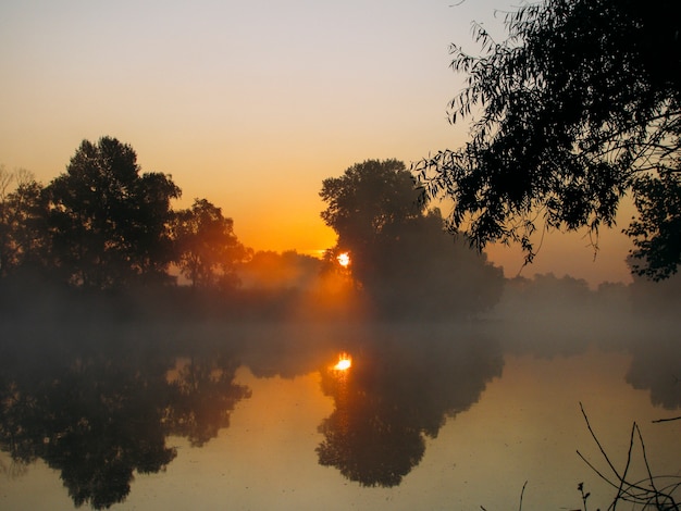 Sunrise and fog on the river