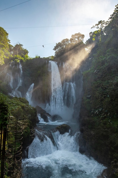 Sunrise inside the Pulhapanzak waterfall on Lake Yojoa vertical photo Honduras