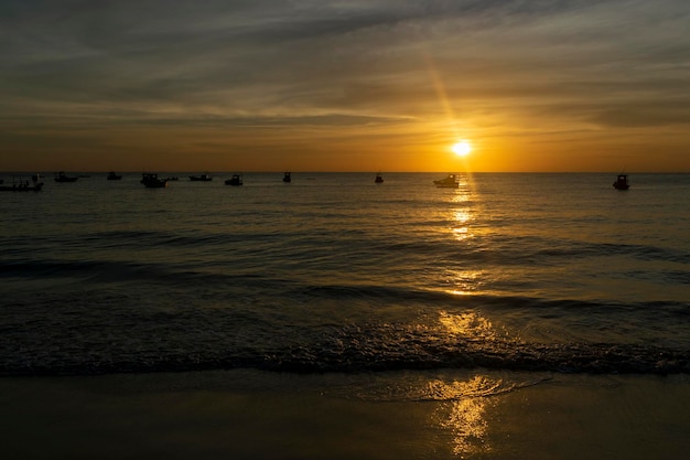 Sunrise and rafts in the sea