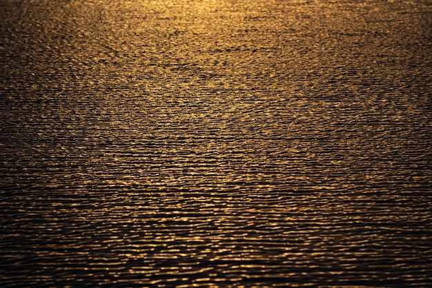 Sunrise sea water background reflection of sun in the ocean water