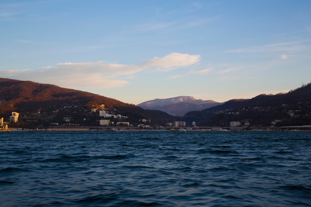 Sunrise over the sea with city in the background