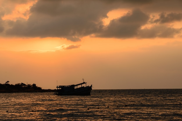 Sunrise  and shadow boat on sea near the beach, Koh Samet Thailand