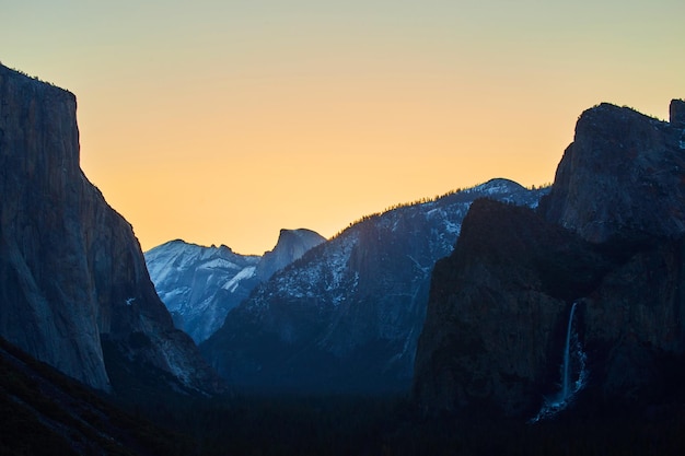 Sunrise silhouettes of Yosemite from Tunnel View with Bridalveil Falls