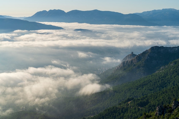 Sunrise views from the Montcabrer mountain with Cocentaina castle at right, Cocentaina.