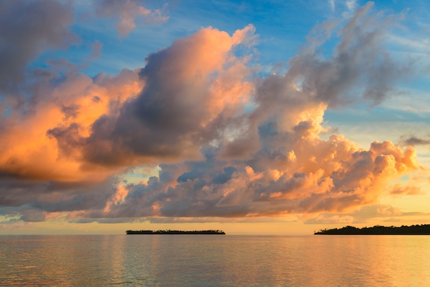 Sunriset dramatic sky on sea, tropical desert beach, no people, stormy clouds