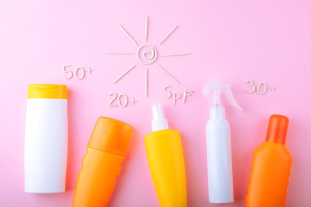 Photo sunscreens on a colored background top view