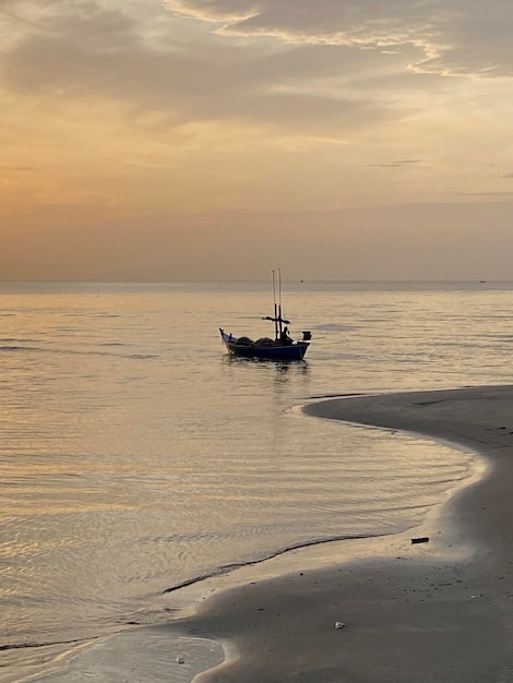 Sunset on beach boat view background