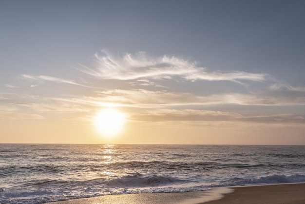 Sunset on the beach of northern portugal, Nazare.