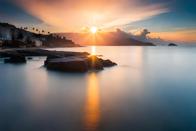 a sunset over a beach with a mountain in the background