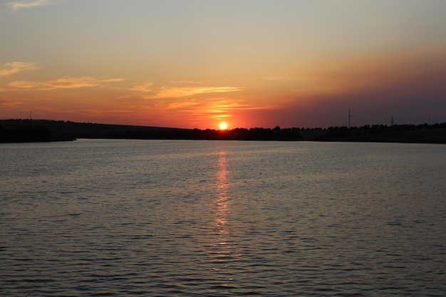 A sunset over a body of water