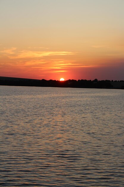 A sunset over a body of water