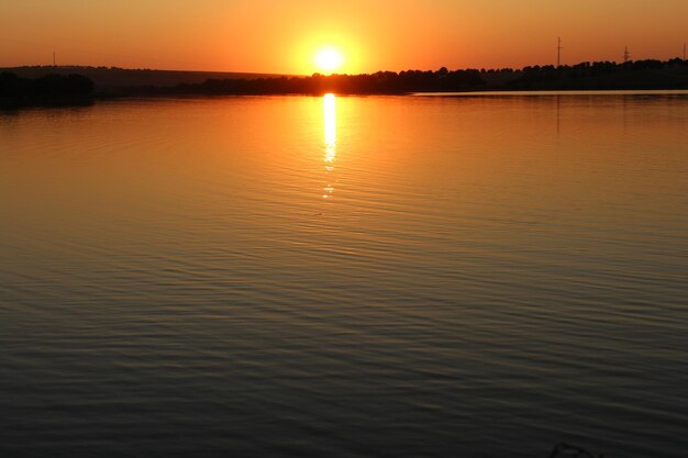 A sunset over a body of water