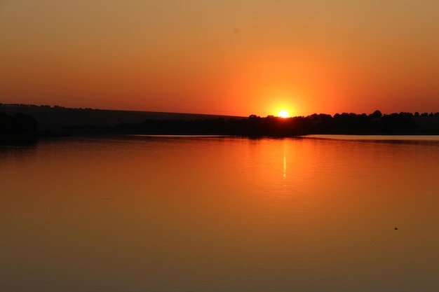 A sunset over a body of water