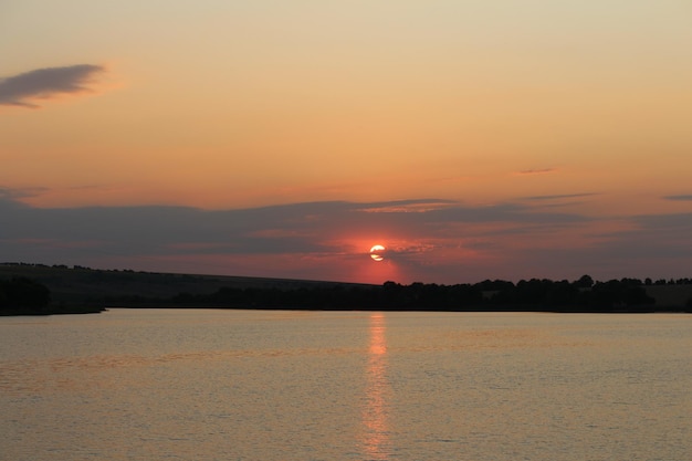 A sunset over a body of water