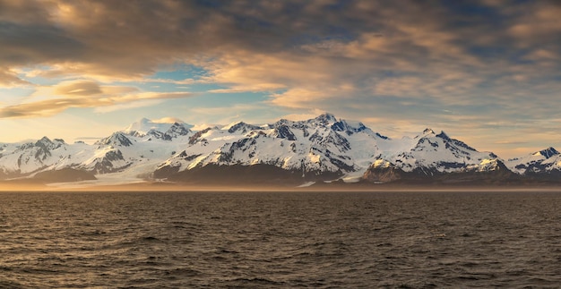 Sunset by mt fairweather and the glacier bay national park in alaska