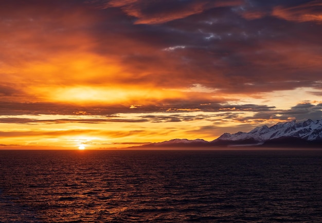 Sunset by mt fairweather and the glacier bay national park in alaska