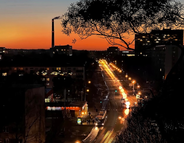 sunset in city view from window night tree shadow car traffic light