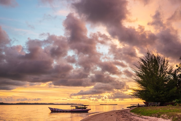 Sunset colorful sky on sea tropical desert beach no people dramatic clouds travel destination getting away long exposure Indonesia Sumatra Banyak Islands