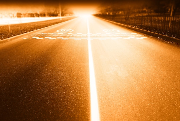 Sunset empty road with two separated lanes background