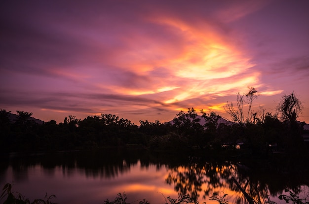 Sunset glow in the sky with reflection from the lake. Amazing natural.