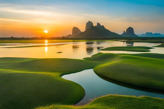 a sunset over a marsh with mountains in the background.