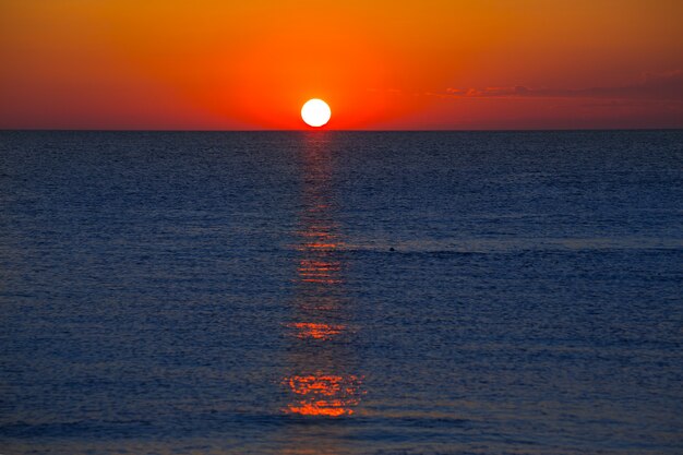 Sunset at Mediterranean sea with orange sky