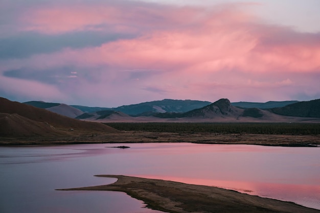 Sunset over Mongolia White lake, also called Terkhiin tsagaan nuur with colorful clouds