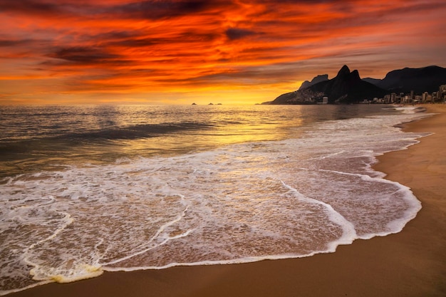 Sunset on the ocean at Rio de Janeiro Ipanema beach Brazil