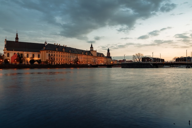 Sunset over the oder river and view of the old town of wroclaw in poland in spring