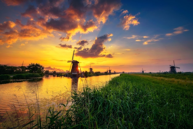 Sunset above old dutch windmills in Kinderdijk Netherlands