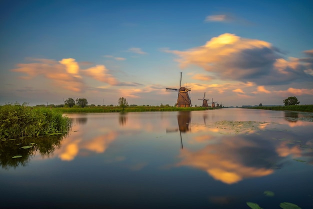 Sunset above old dutch windmills in Kinderdijk Netherlands