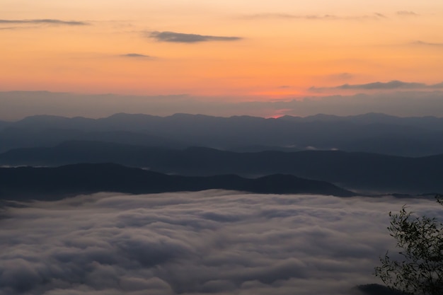  sunset overlooking mountains with Mist