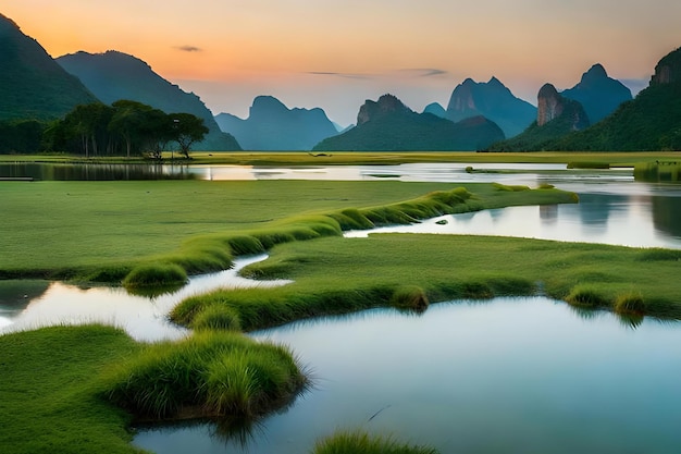 A sunset over a river with mountains in the background.