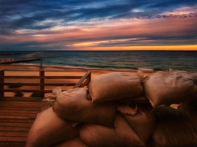 Sunset on the sea coast sandbags Illustration