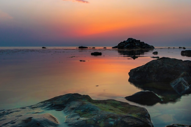 Sunset over the sea horizon