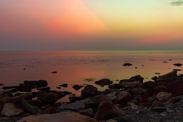 Sunset over the sea horizon