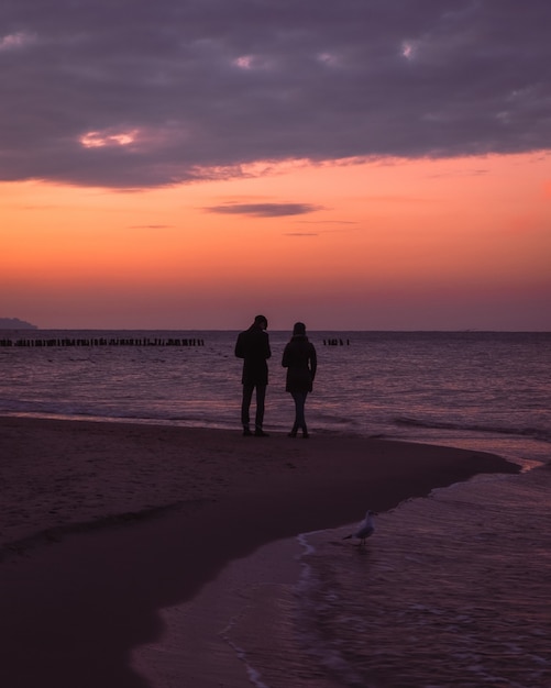 Sunset at the sea Silhouette of romantic couple